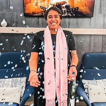 young woman throwing confetti